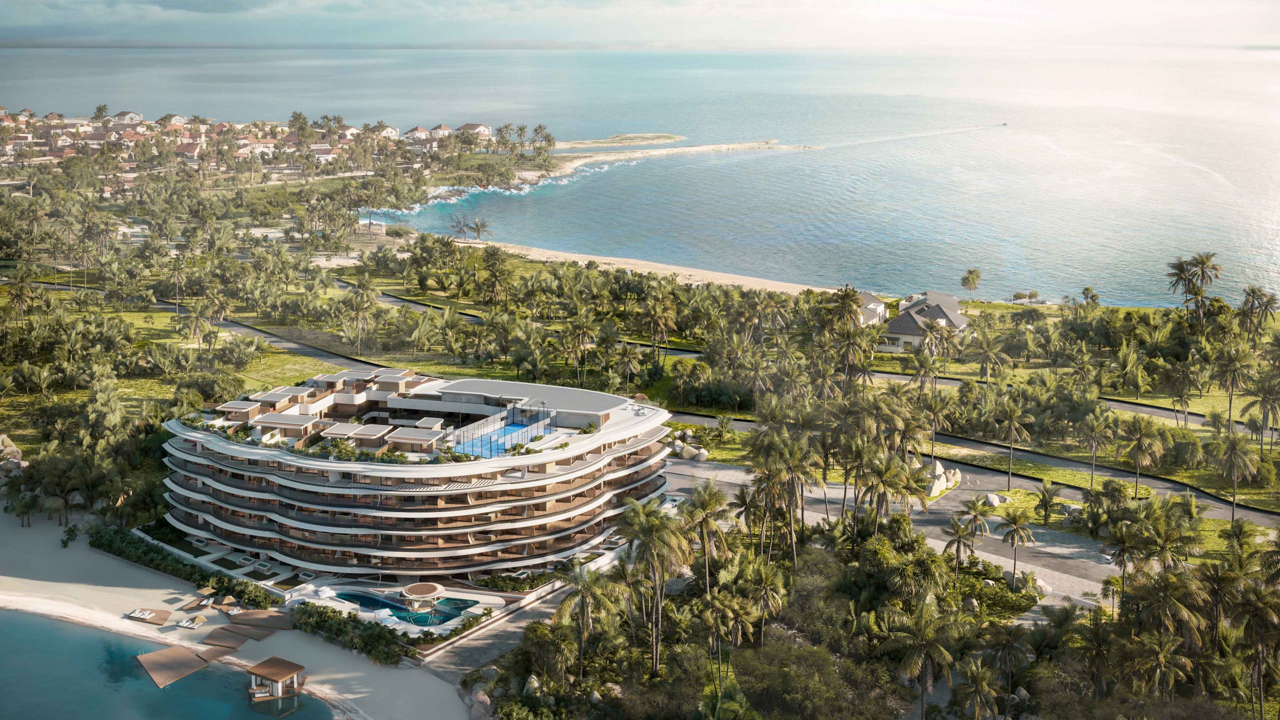 Vista aérea de Puerto Marina Residences mostrando su ubicación privilegiada frente al mar en Cap Cana, rodeado de vegetación tropical y una costa que resalta la relación directa del proyecto con el paisaje.