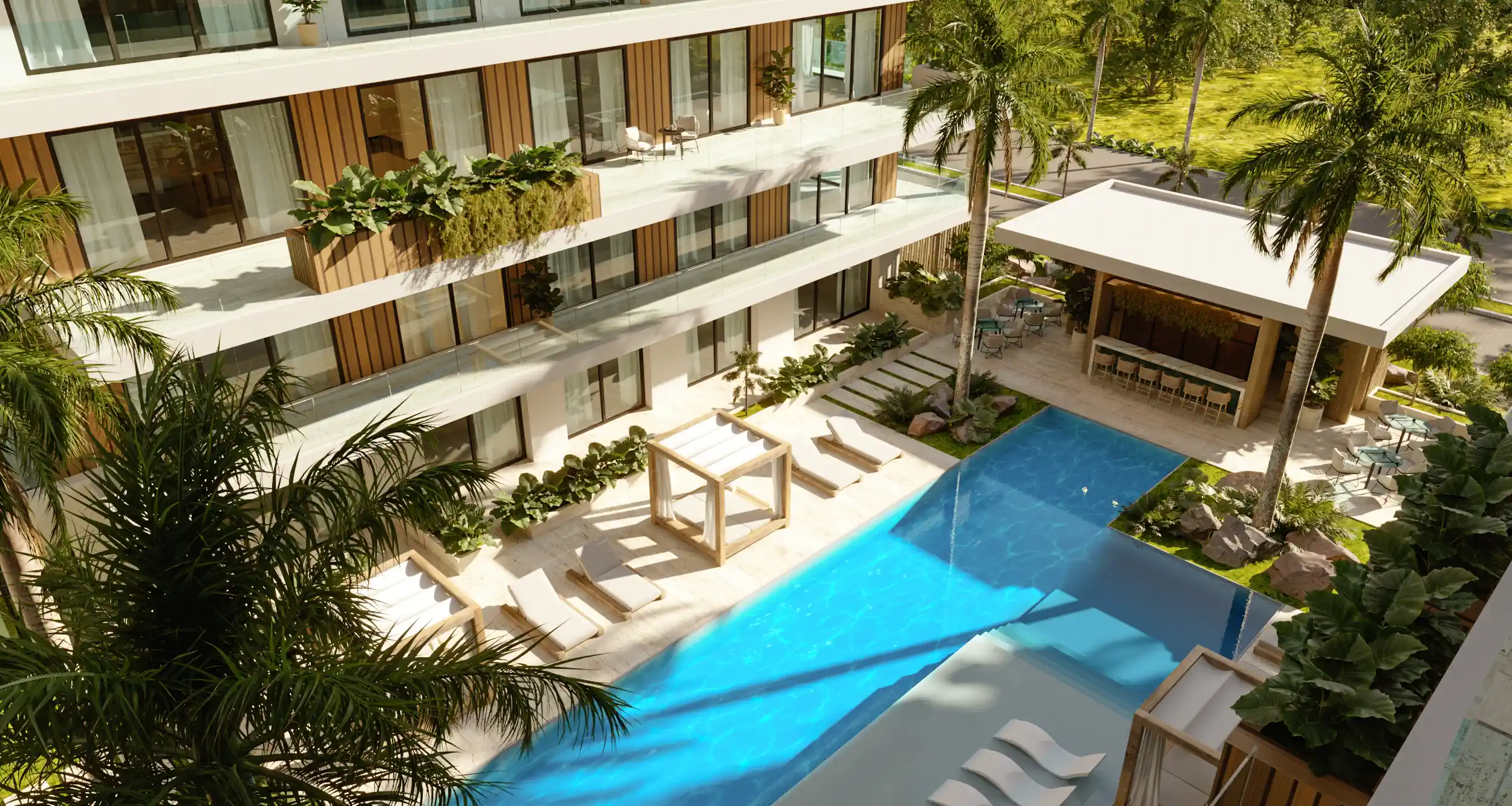 Piscina con diseño moderno rodeada de palmeras y zonas lounge en residencial de lujo en Cap Cana