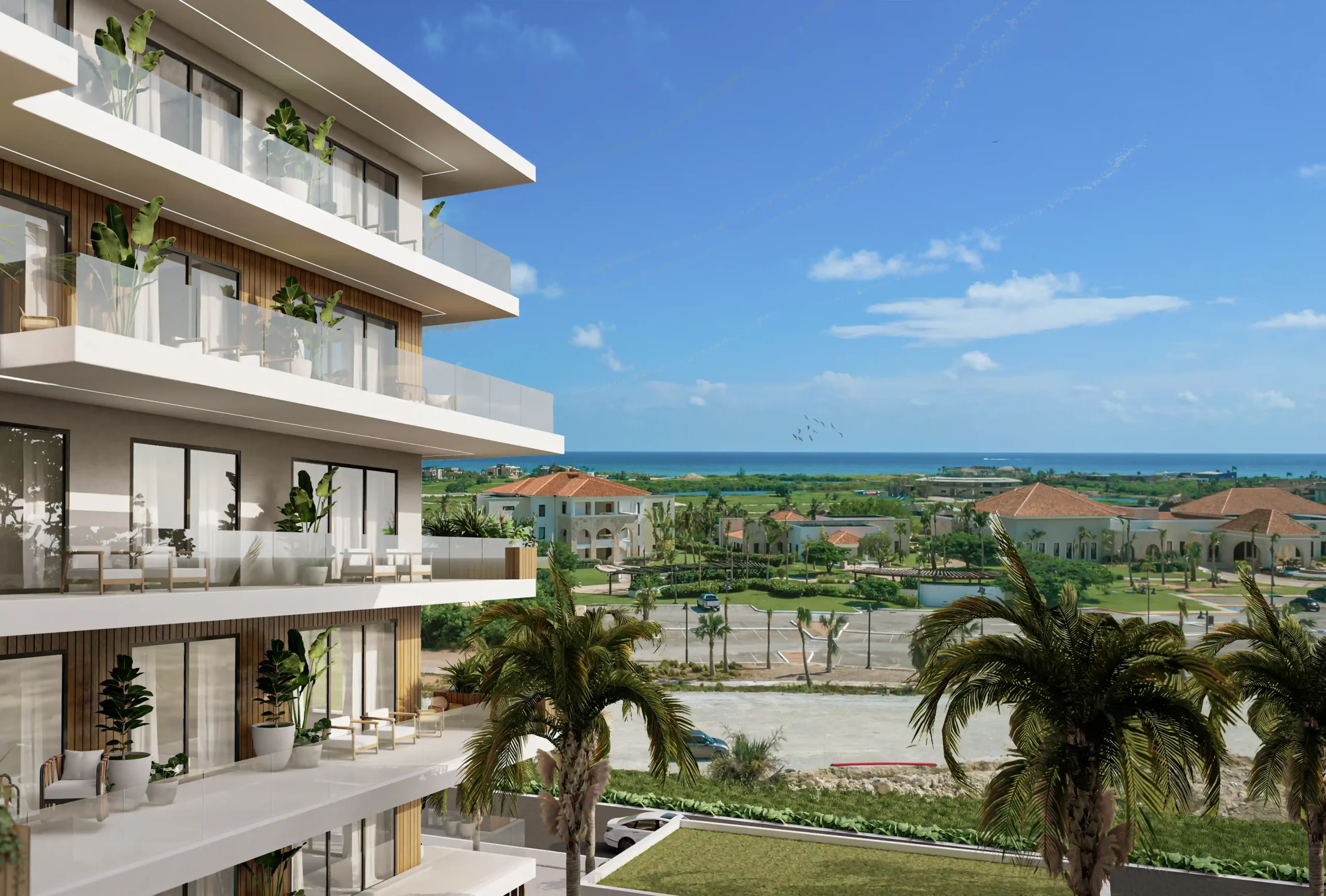 Esquina de edificio en forma de U con balcones amplios y vistas abiertas en Cap Cana